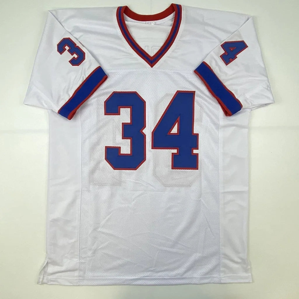 White short-sleeved custom jersey with blue and red trim from the Thomas 34 autographed football collectible, perfect for professional sports fans