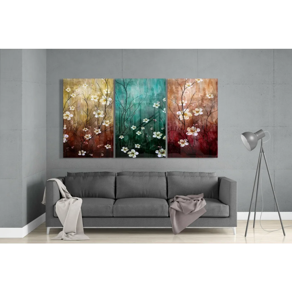 Abstract floral wall art with white blossoms on dark branches in gold, teal, rust gradients