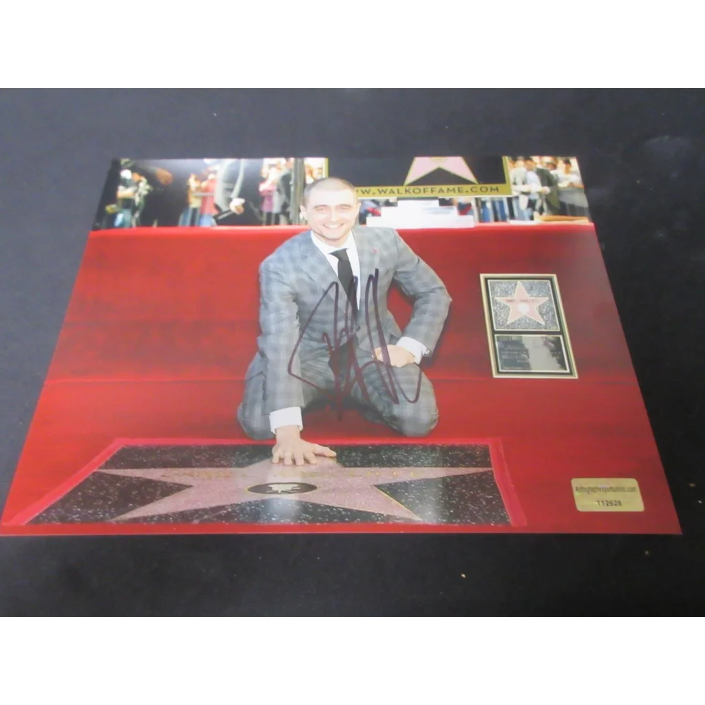 Daniel Radcliffe signed 8x10 photo of him posing on Hollywood Walk of Fame
