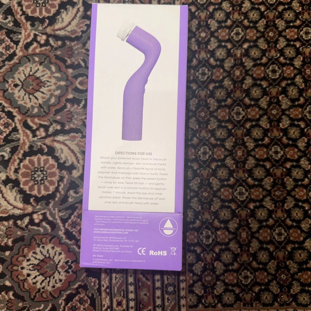 Purple Dermaluxe Advance Cleansing facial brush in box