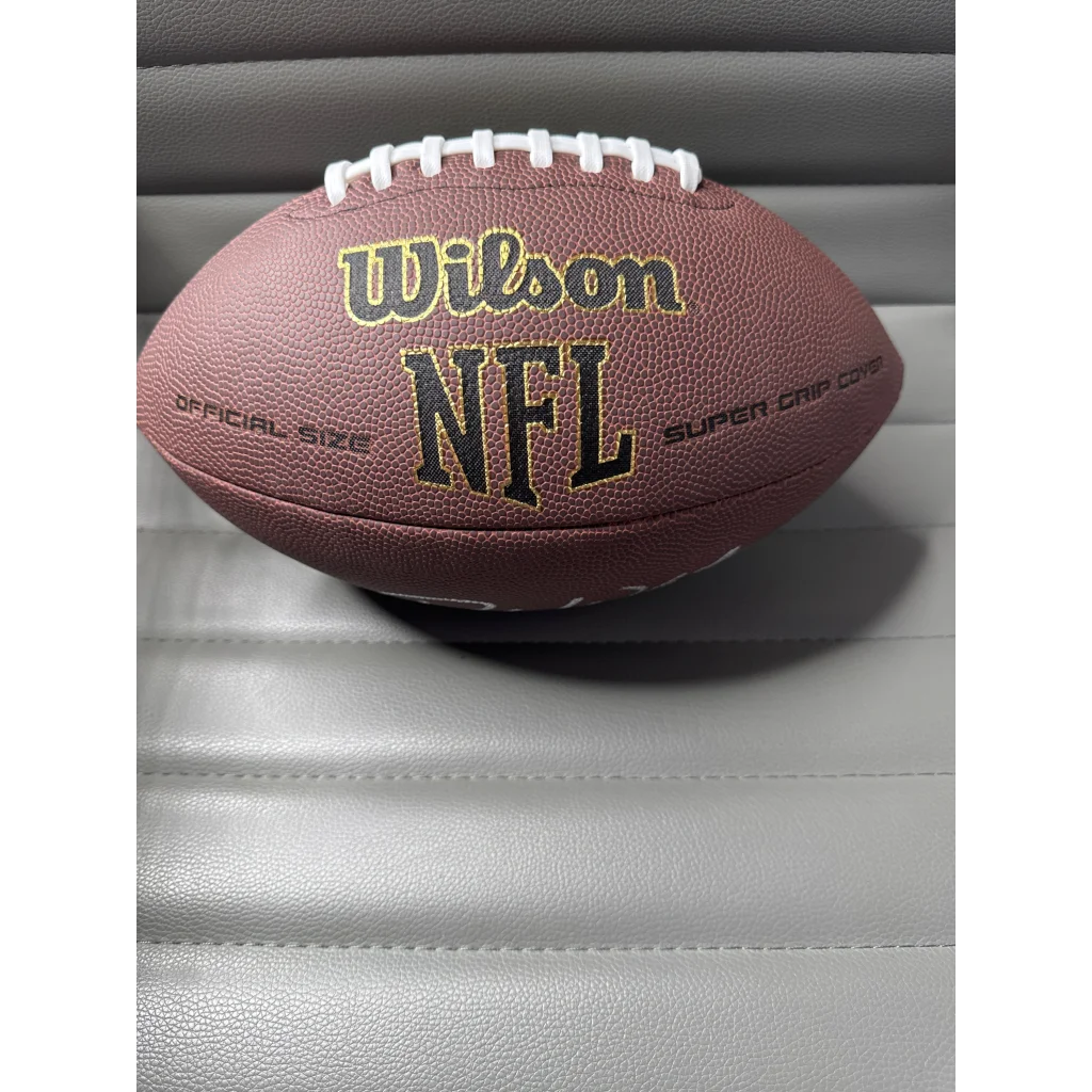 Brown leather Deshaun Watson autographed football with white laces and pink details