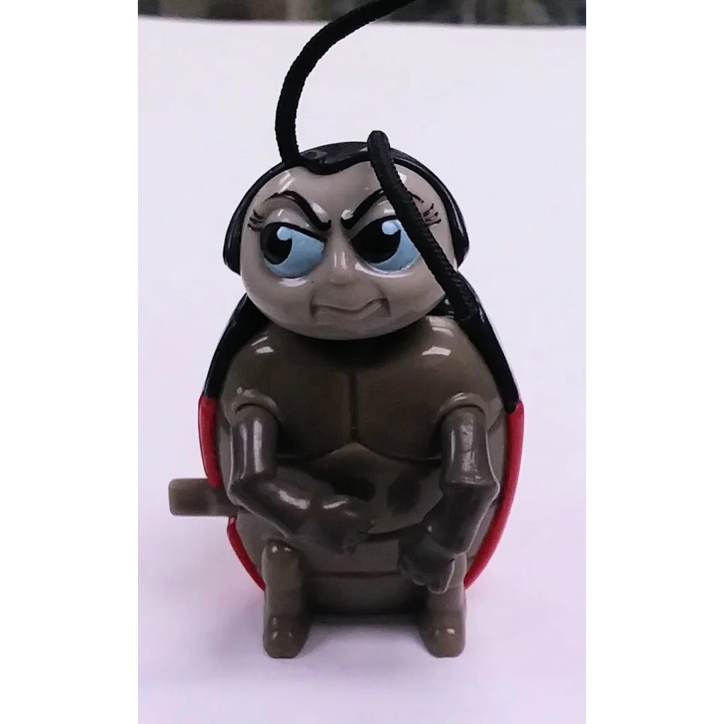 Brown plastic ladybug keychain with red wings and black spots, Francis Happy Meal toy from A Bugs Life 1998