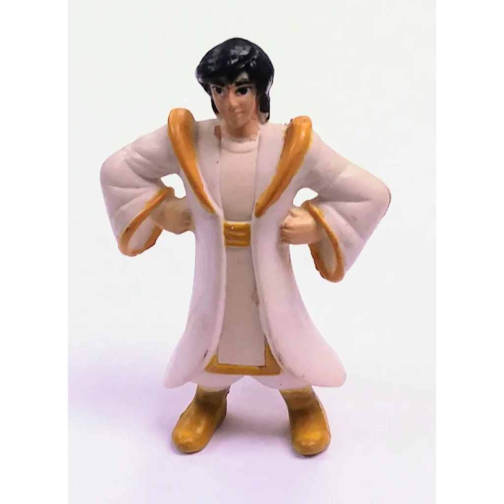 Vintage 1996 Disney PVC figure of Elvis Presley in white and gold costume
