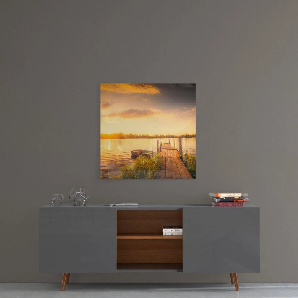 Sunset dock tempered glass art on wooden pier with calm water and orange-gray sky