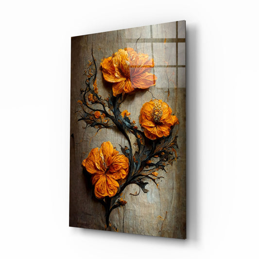Three vibrant orange flowers with dark branches on a textured gray background, displayed on angled glass panel showing shadow and depth.