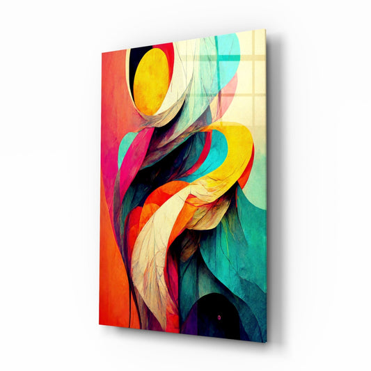Angled view of glass wall art displaying colorful swirling ribbon petals in red, yellow, cyan, and orange against cream and dark backgrounds.