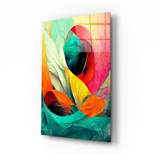 Abstract glass wall art panel displayed at an angle, showing colorful layered petals in red, orange, yellow, teal, and green with translucent overlapping sections.