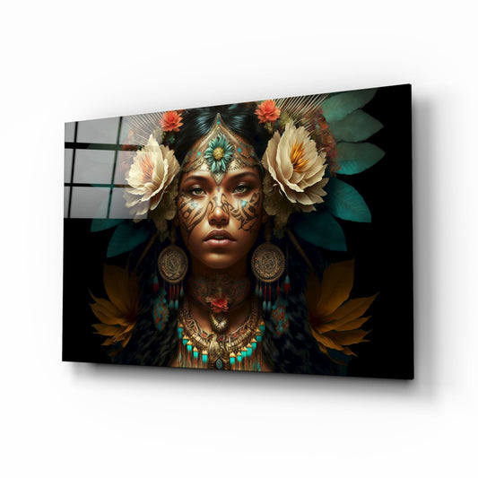 Glass wall art displaying woman with ornate facial tattoos, white roses, gold jewelry, and teal accents against dark background, shown at three-quarter angle.