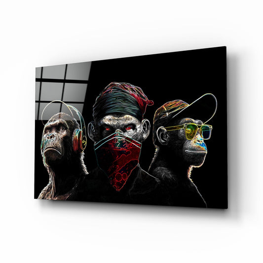 Three stylized monkeys with neon outlines on black glass displayed at an angle, showing headphones, bandana, and sunglasses.