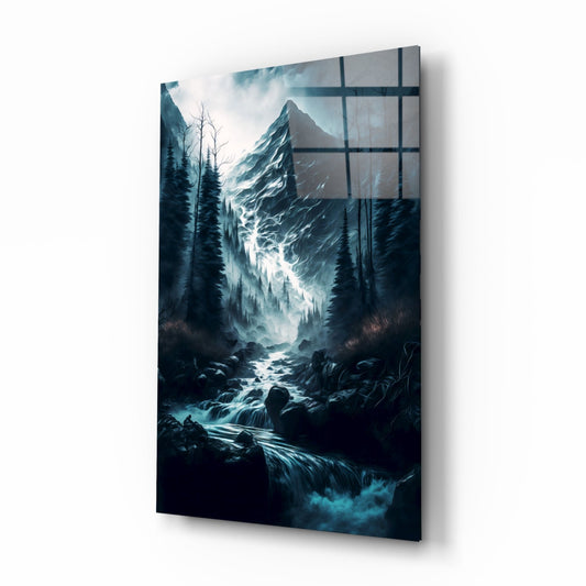 Angled perspective of glass wall art featuring misty mountain peak, forest, and waterfall with blue-toned colors and dark grid overlay.
