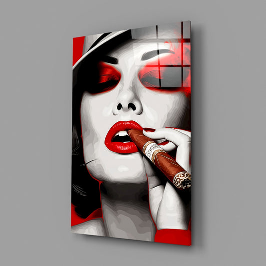 Modern glass wall art displaying stylized portrait of woman with red lips and eyes smoking cigar, black and white with red accents, angled perspective view.