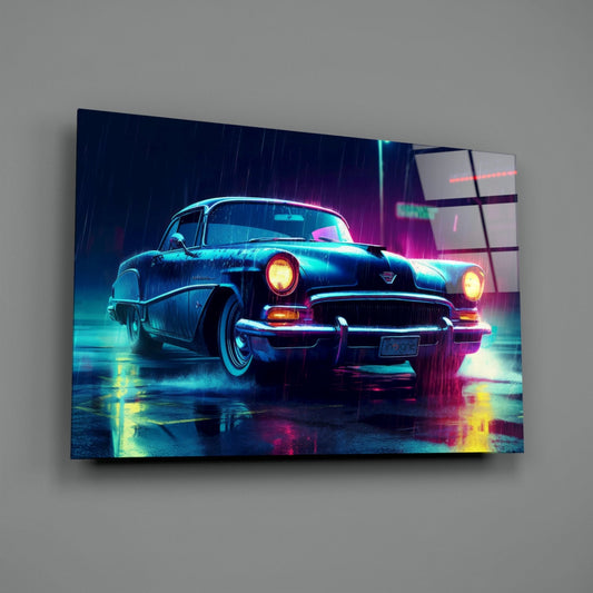 Neon-lit vintage 1950s car displayed on glass wall art with cyan, magenta, and yellow lighting effects in rain.