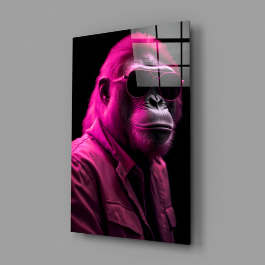 Angled view of a gorilla wearing hot pink aviators and jacket against black background on glass panel with grid overlay.