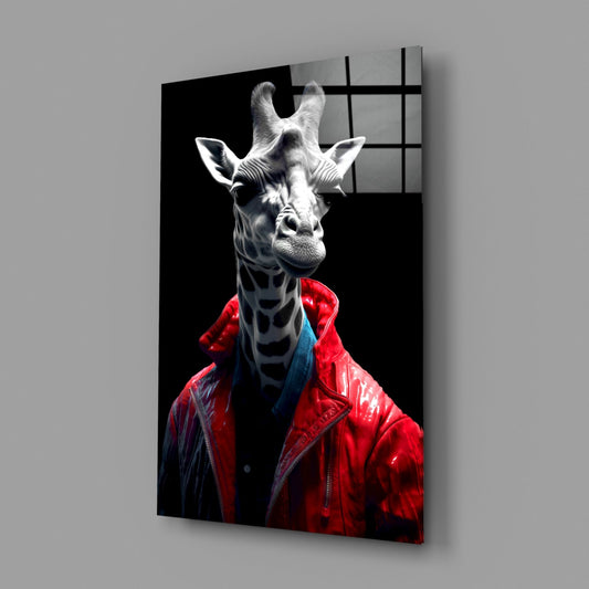Angled view of glass wall art featuring a white giraffe wearing a red leather jacket against black background, displayed on gray wall.