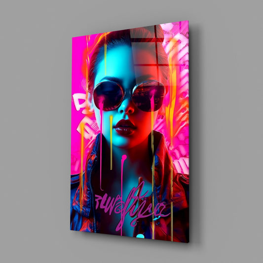 Angled front view of a glass wall art panel featuring a neon-lit portrait of a woman wearing sunglasses with magenta, cyan, and yellow lighting effects and "Punk" graffiti text at the base.