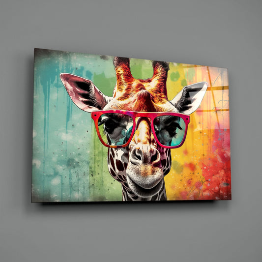 Vibrant glass wall art depicting a giraffe wearing hot pink sunglasses against a colorful watercolor background of turquoise, yellow, and red splashes.