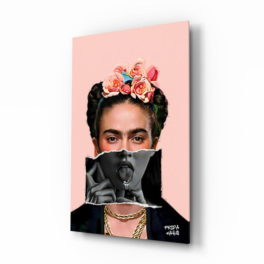 Glass wall art panel displayed at an angle showing a portrait with pink background, floral crown, and black collage elements with gold chain detail.