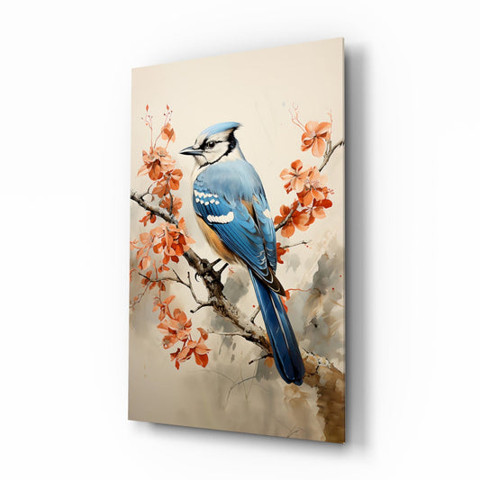 Blue jay perched on branch with orange blossoms displayed as angled glass wall art against cream background.