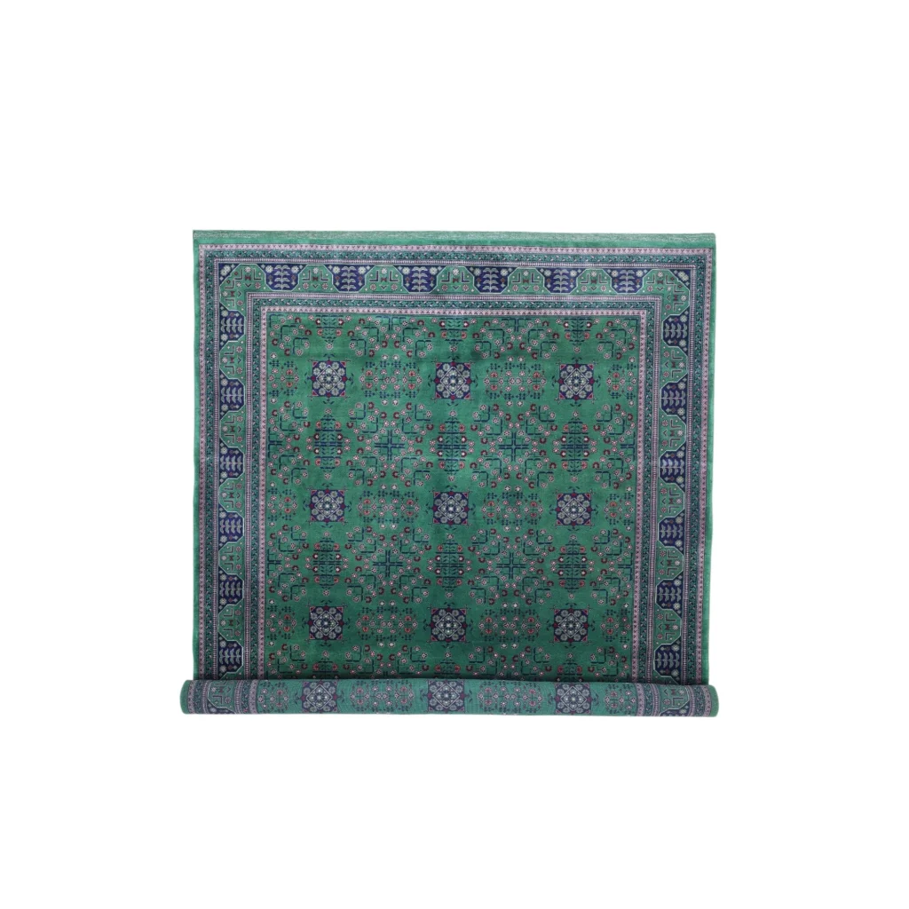Rich emerald green Afghan rug with cotton foundation and intricate geometric patterns