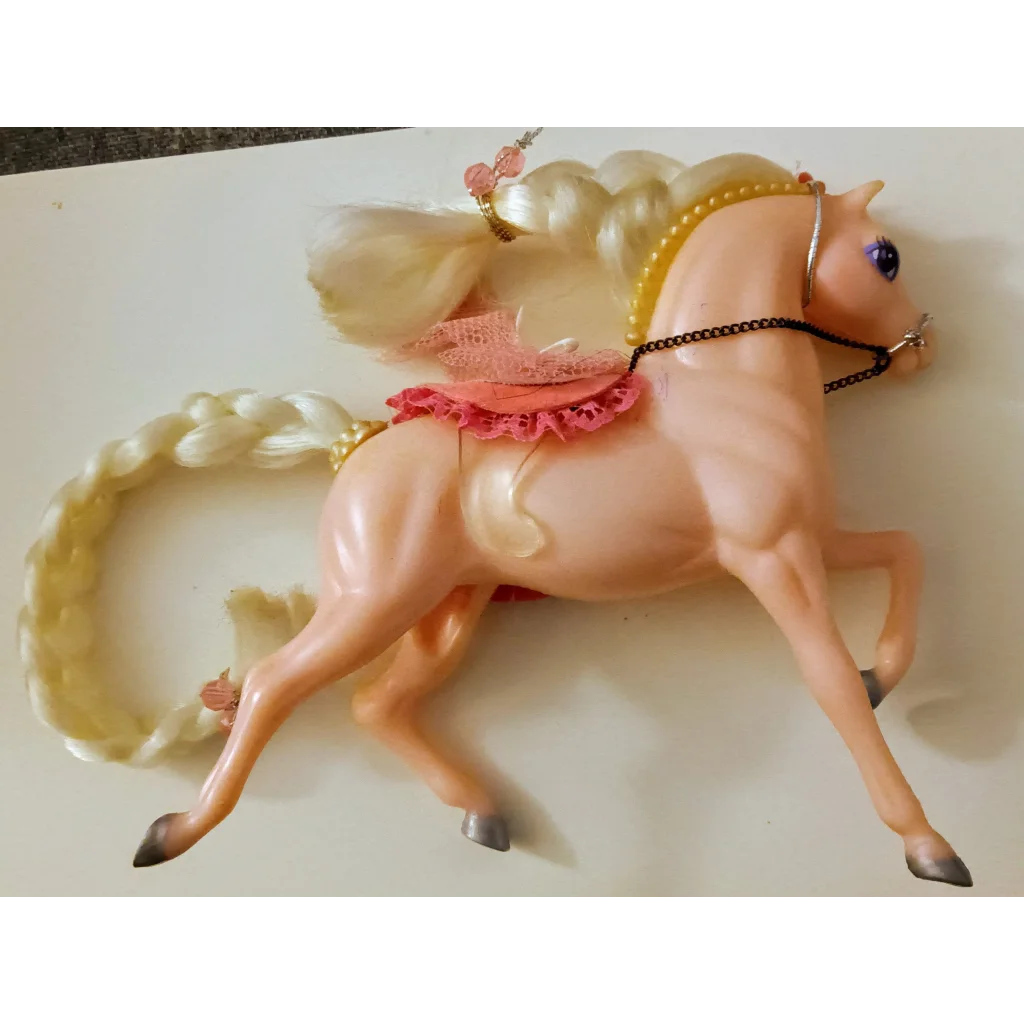 Pink Enchanted Kingdom Horse with white mane, tail, and tutu skirt