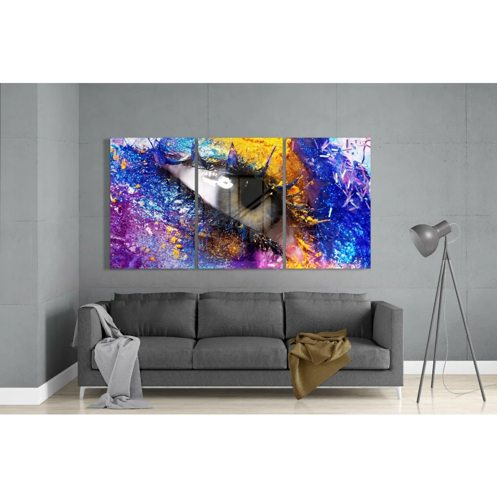 Mesmerizing eye abstract triptych canvas wall art with swirling purple, blue, yellow, orange hues and central silver reflection