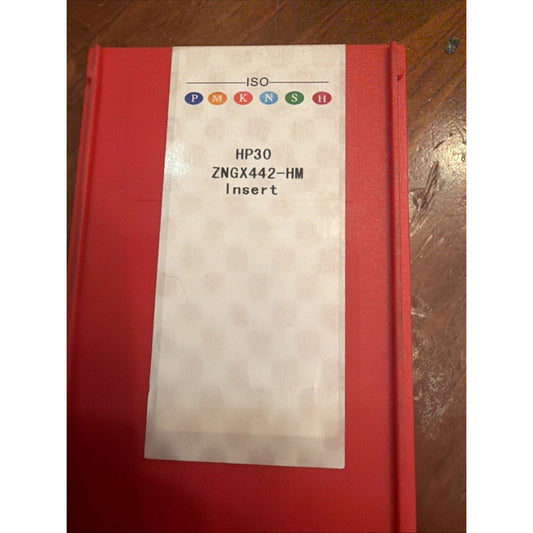 Red cardboard box with cream-colored label displaying ISO PMKNSH logo and text "HP30 ZNGX442-HM Insert" on wooden surface.