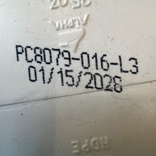 Close-up of printed batch code "PC8D179-016-L3" and date "01/15/2028" stamped in black ink on white product container.