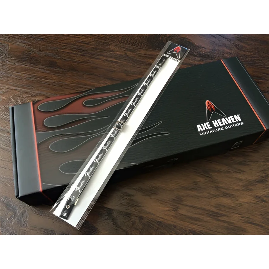 Axe Heaven silver flame pick holder on Fender logo mini model guitar strap