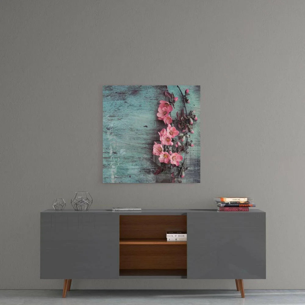 Vibrant pink blossoms on teal textured glass wall art for home