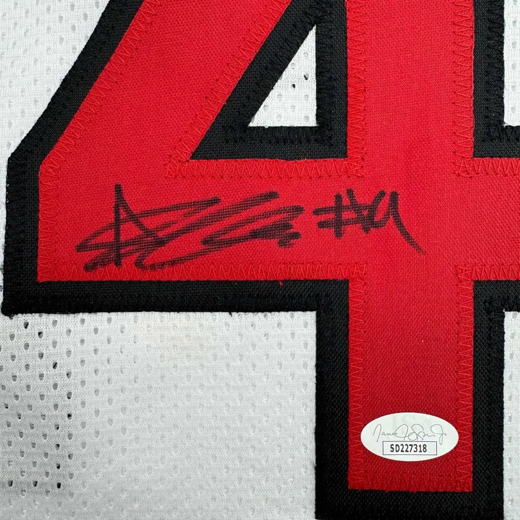 White and red Bailey Basketball Jersey with autograph and authenticity sticker displayed in frame