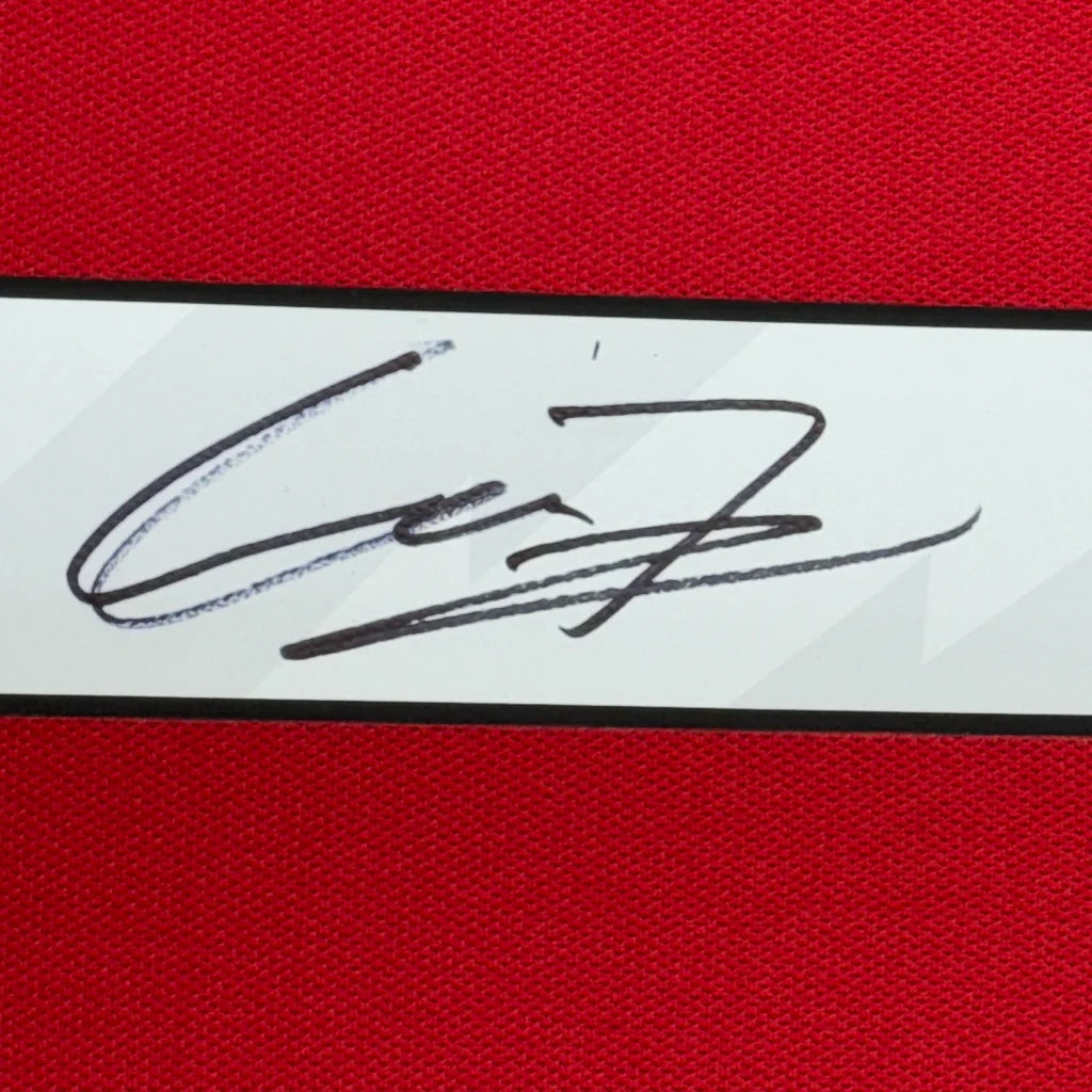 Framed autographed Alejandro Garnacho Manchester United jersey with black ink signature on white label, red background