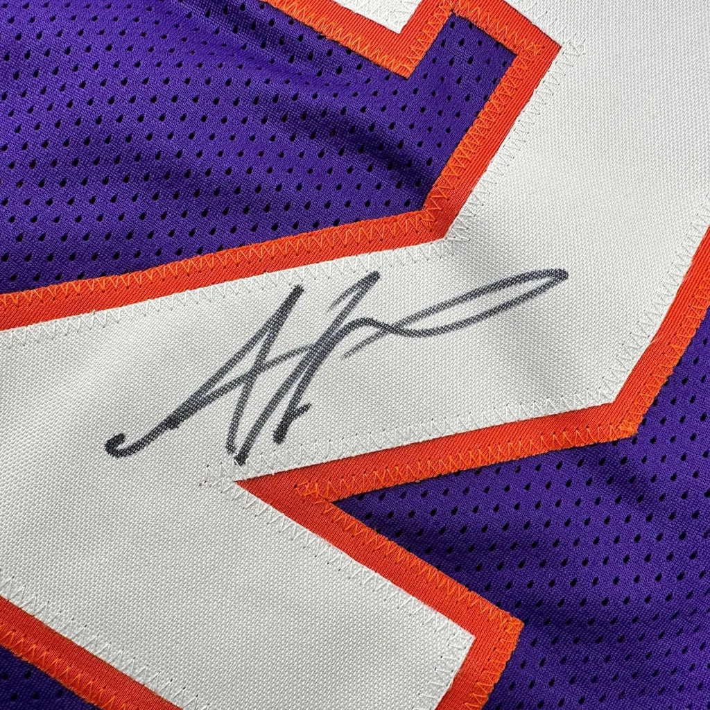 Autographed Purple Phoenix Suns Jersey framed as a showpiece for Amare Stoudemire fans