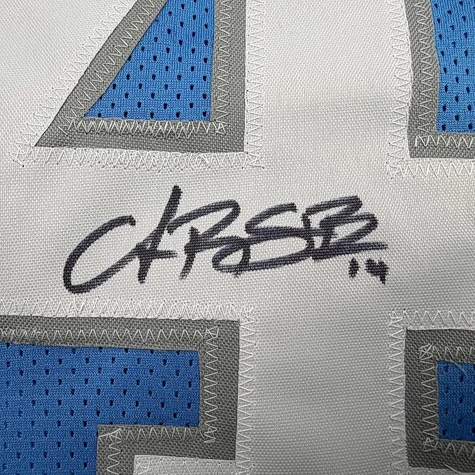 Framed autographed Amon-Ra St. Brown Detroit Current blue jersey with blue gray geometric fabric and black signature