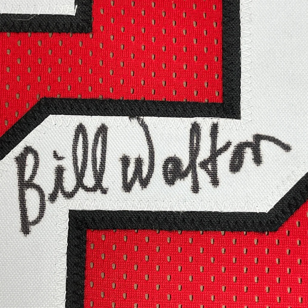 Red and white Bill Walton signed sports jersey with black trim ready for wall display