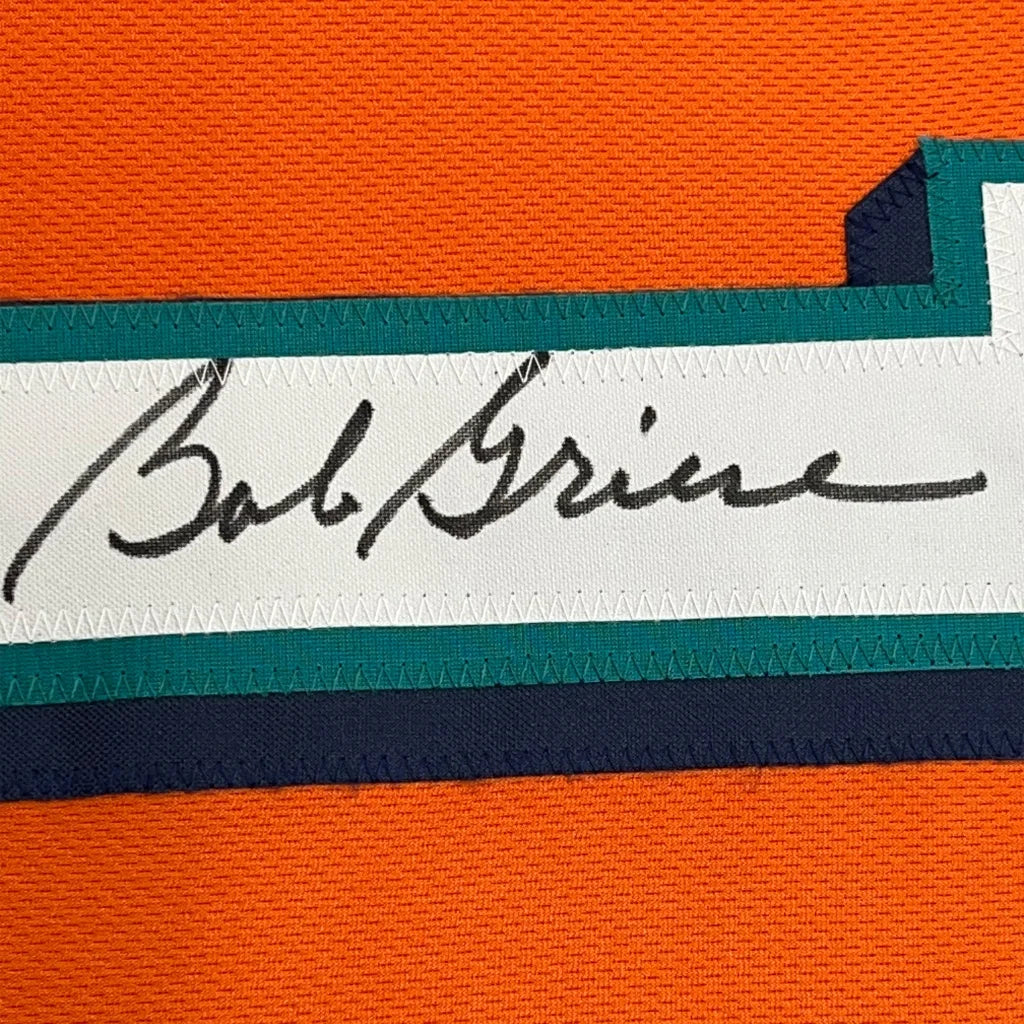 Framed autographed Bob Griese orange Miami jersey with Bob Brine label