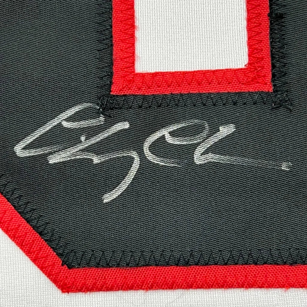 Autographed Black and Red Clark Griswold Hockey Jersey ready to display
