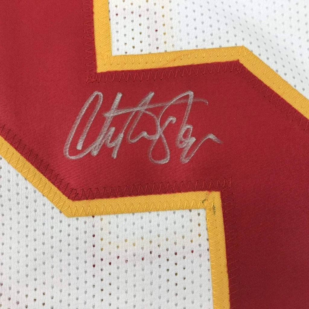 White and red Christian Okoye Chiefs jersey with silver autograph and action photos