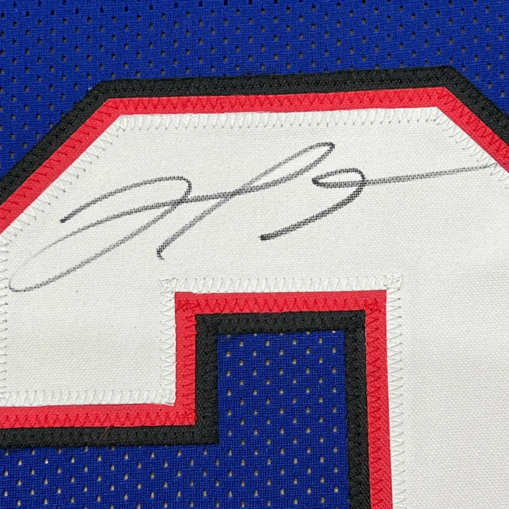 Autographed blue Buffalo Bills jersey with red, white, black trim and photos frame