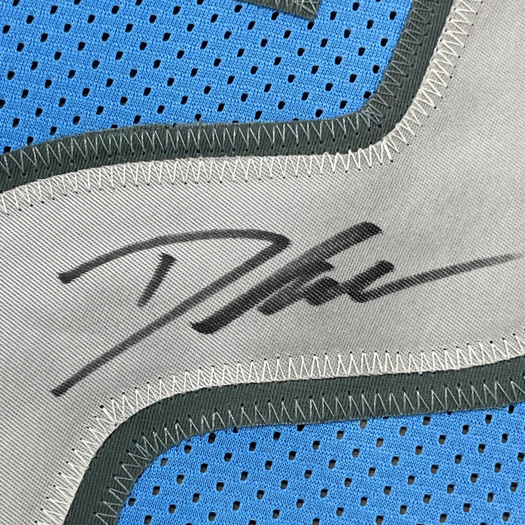 Autographed D’Andre Swift blue Detroit Lions jersey with mesh shoe detail