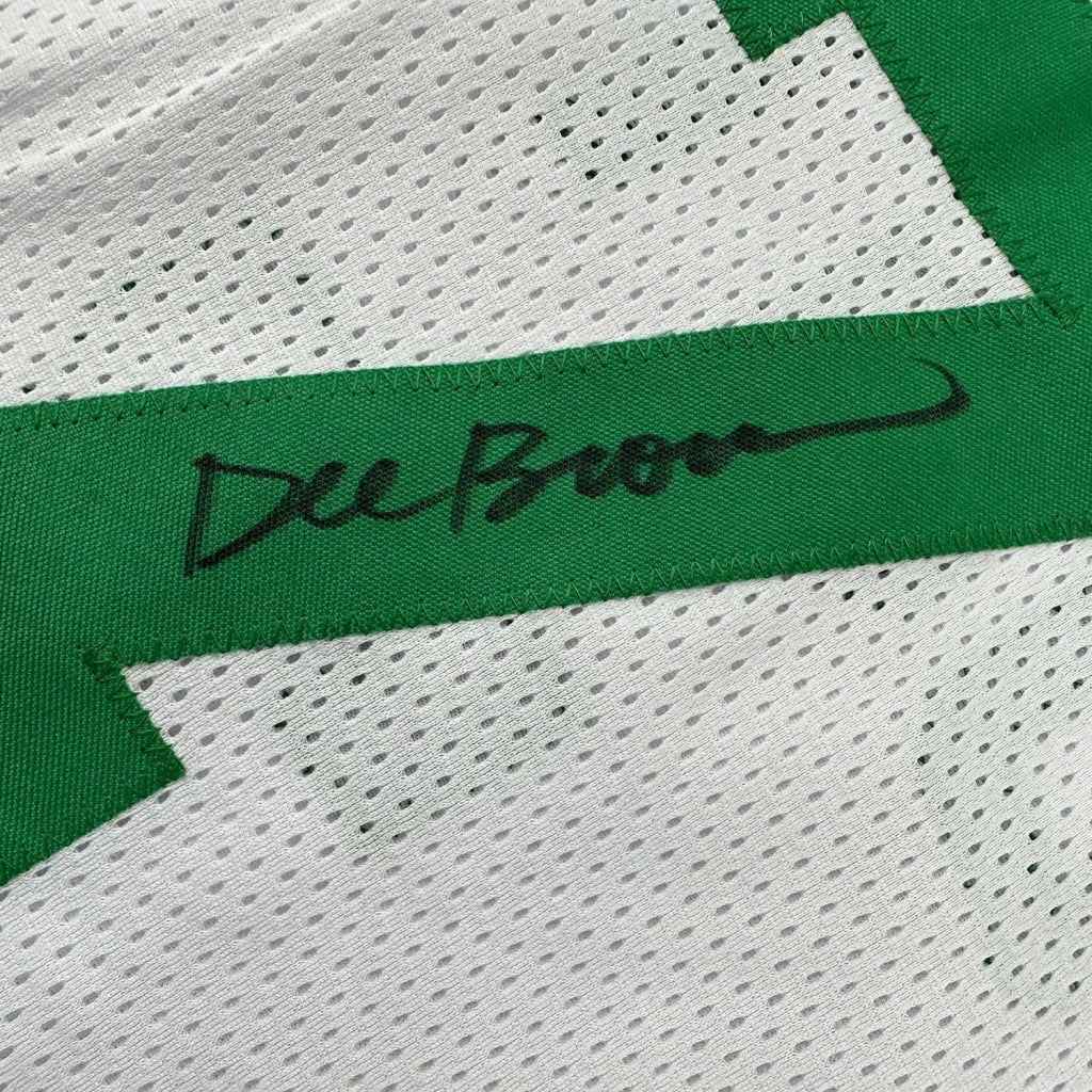 White mesh Celtics jersey with green stripe signed by Dee Brown in framed action photo