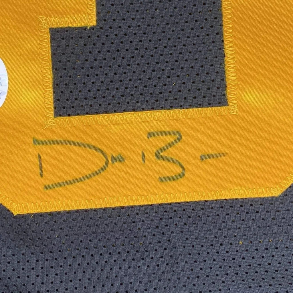 Yellow and black athletic jersey with perforated mesh design featuring number 1 in dark gray and yellow stitching