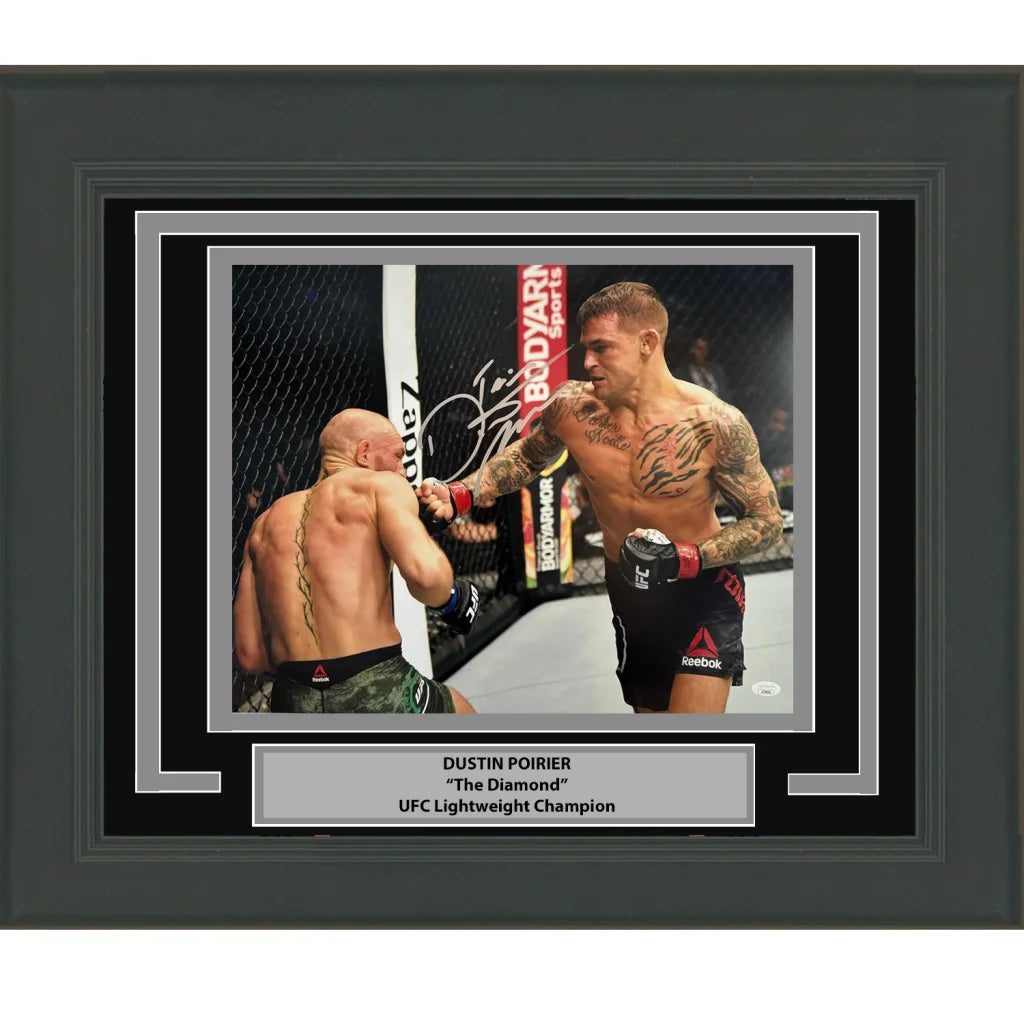 Signed black-framed photo of UFC champion Dustin Poirier in octagon action