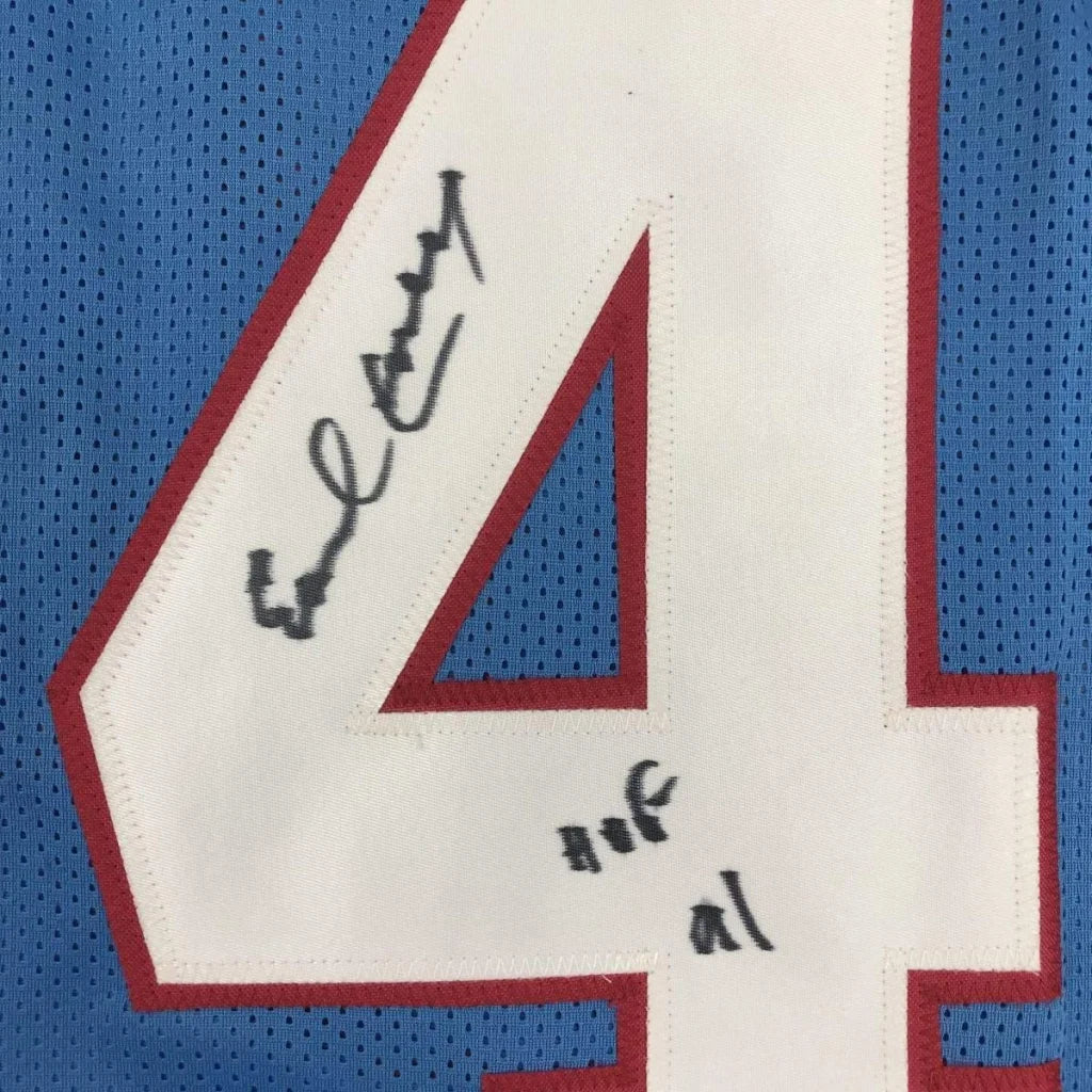 Light blue Earl Campbell HOF signed jersey with black signatures, perfect for your man cave