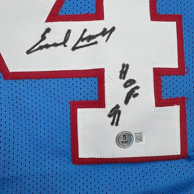 Framed autographed Earl Campbell HOF blue mesh jersey back with signed number 4