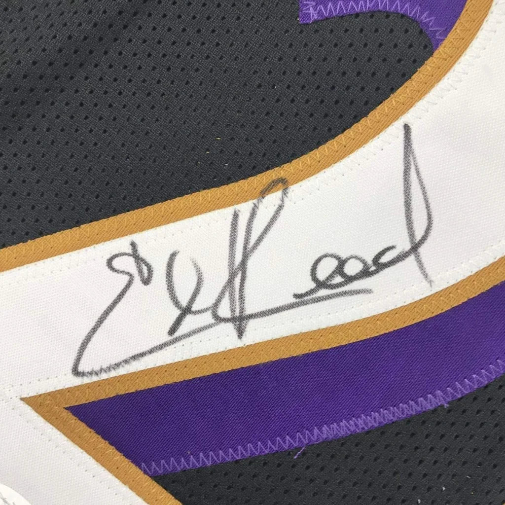Framed autographed black Ed Reed Baltimore Ravens jersey with gold trim, JSA COA