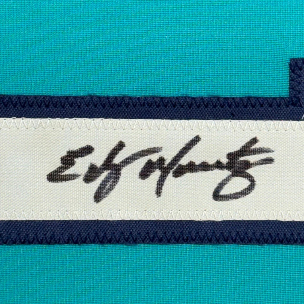 Teal athletic fabric with white and navy trim on Edgar Martinez signed jersey display