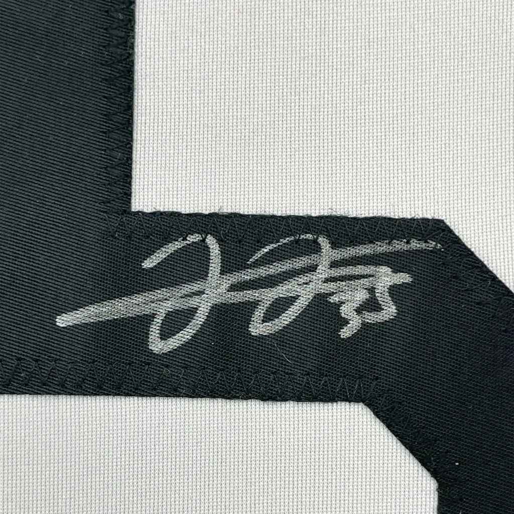 Framed autographed Frank Thomas Chicago White Sox jersey with silver embroidered signature tag, JSA COA
