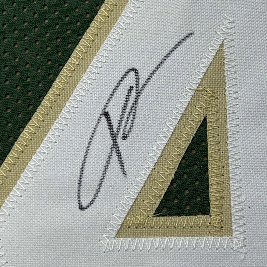 Framed autographed Giannis Antetokounmpo custom green jersey with black ink signature on mesh