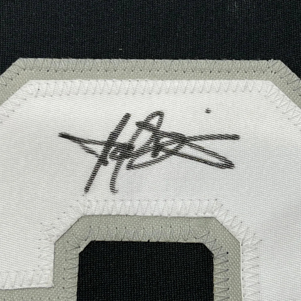 Framed autographed Harold Baines Chicago Blackhawks jersey with embroidered number patch