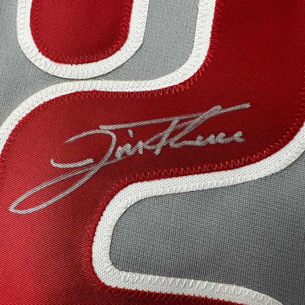 Autographed red and grey Thome 25 jersey with white stitching in framed display